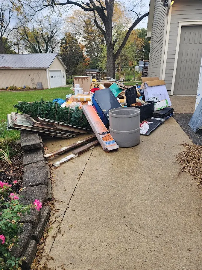 Dumpster being loaded with debris for Commercial Dumpster Rental in Schuyler Falls